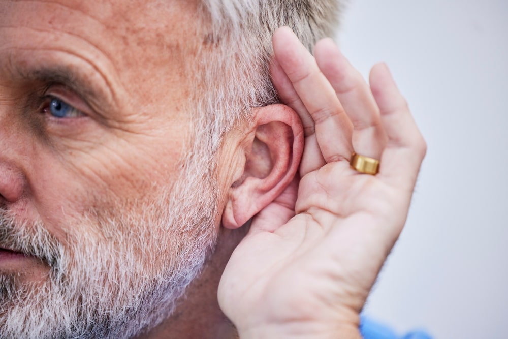 Man strains to hear